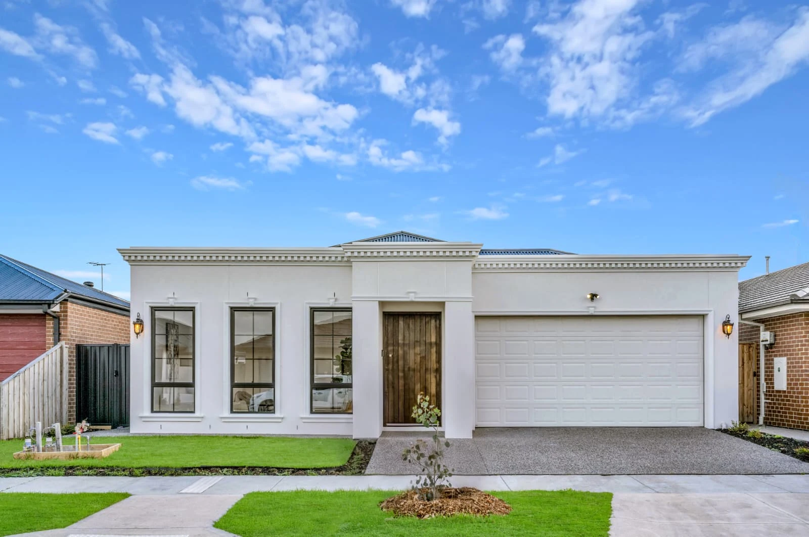 Contemporary white home with landscaped entrance